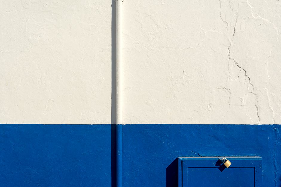 A white and blue painted wall.
